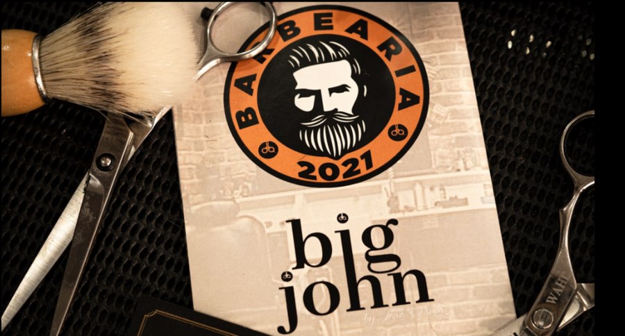 Logótipo da Barbearia Big John, fundada em 2021, com tesoura e pincel de barba