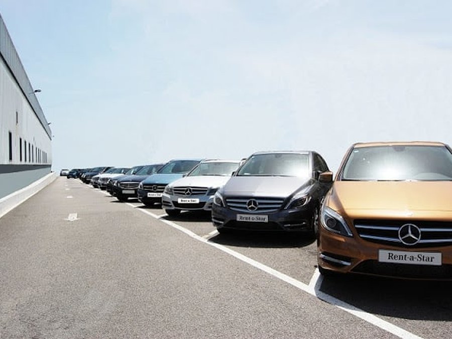 Row of rental cars parked near Porto Airport